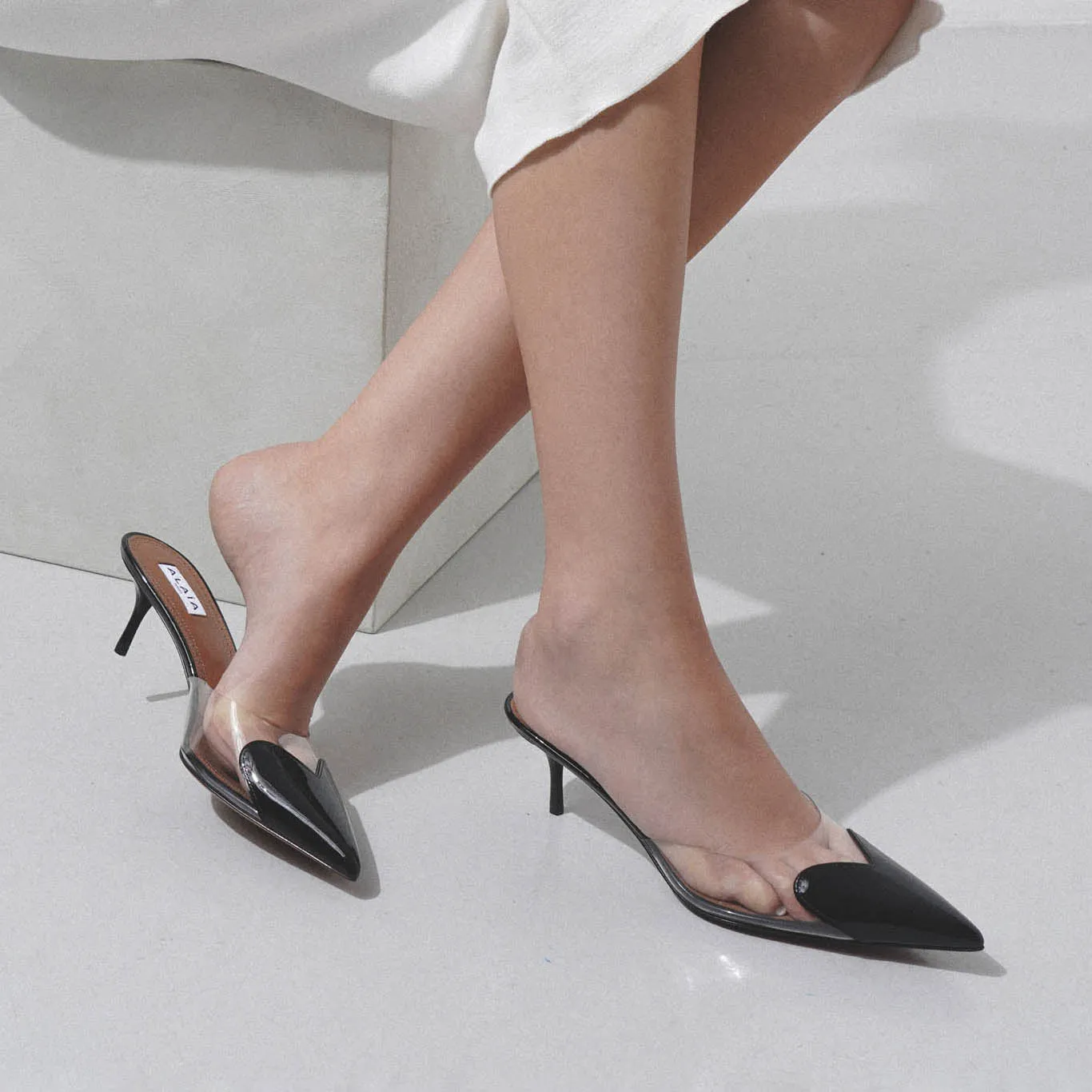 Coeur 55 black patent mule pumps